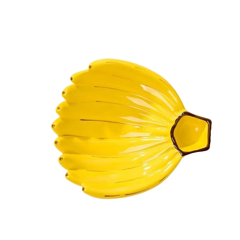 Living room household banana dumpling plate ceramic creative simple artistic decoration storage fruit plate
Living room household banana dumpling plate ceramic creative simple artistic decoration storage fruit plate