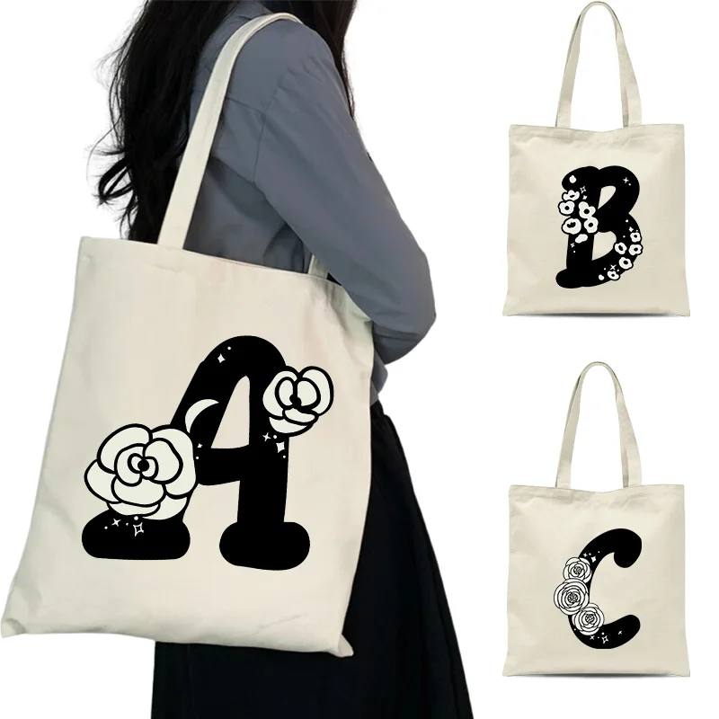 Elegant black letters and flowers women's shoulder bag ins artistic floral daily versatile student armpit canvas bag
Elegant black letters and flowers women's shoulder bag ins artistic floral daily versatile student armpit canvas bag