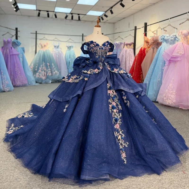 Navy Blue Shiny Ball Gown Quinceanera Dresses 2026 Applique Flower Beading Crystal Bow Tull Corset Off Shoulder Sweet 16 Dress
Navy Blue Shiny Ball Gown Quinceanera Dresses 2026 Applique Flower Beading Crystal Bow Tull Corset Off Shoulder Sweet 16 Dress