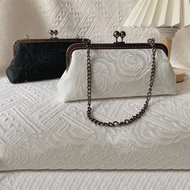 Lost In Vintage Black Cotton Evening Bag Covered Rose Pattern Lace Floral Metal Frame with a Kiss Clasp Fastening Long Chains
Lost In Vintage Black Cotton Evening Bag Covered Rose Pattern Lace Floral Metal Frame with a Kiss Clasp Fastening Long Chains