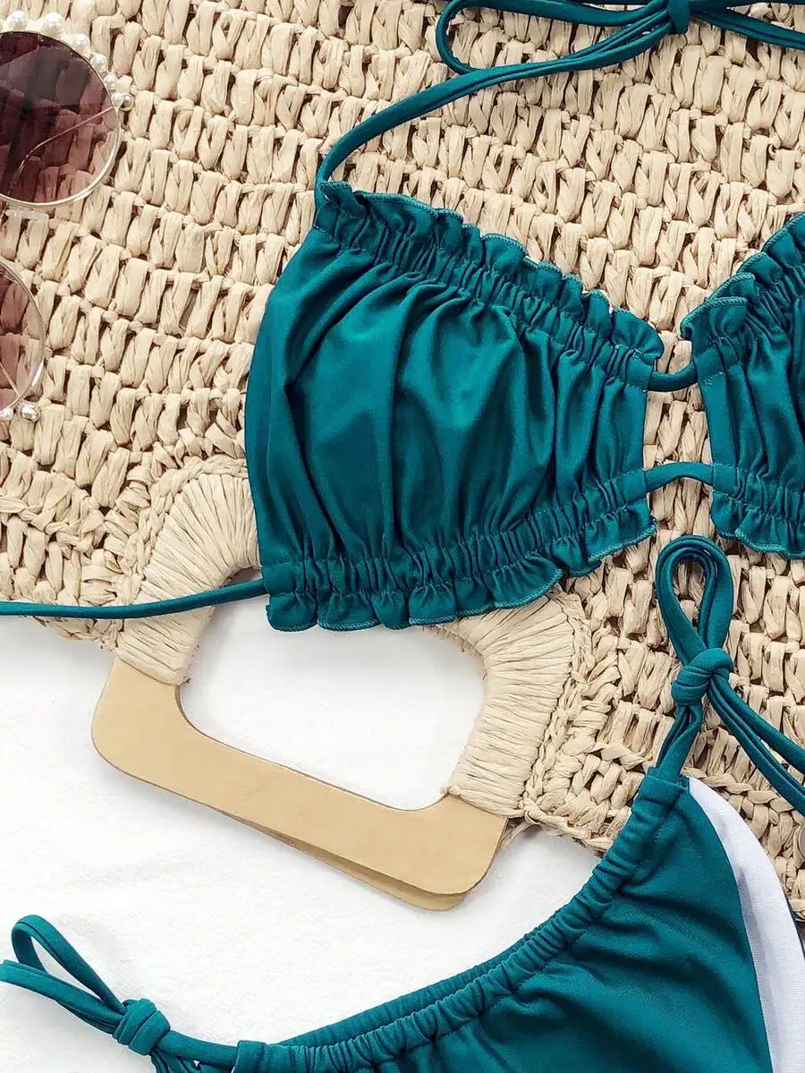 Teal Solid Halter Bikini Set With Ruched Detail And Adjustable Tie Straps
Teal Solid Halter Bikini Set With Ruched Detail And Adjustable Tie Straps