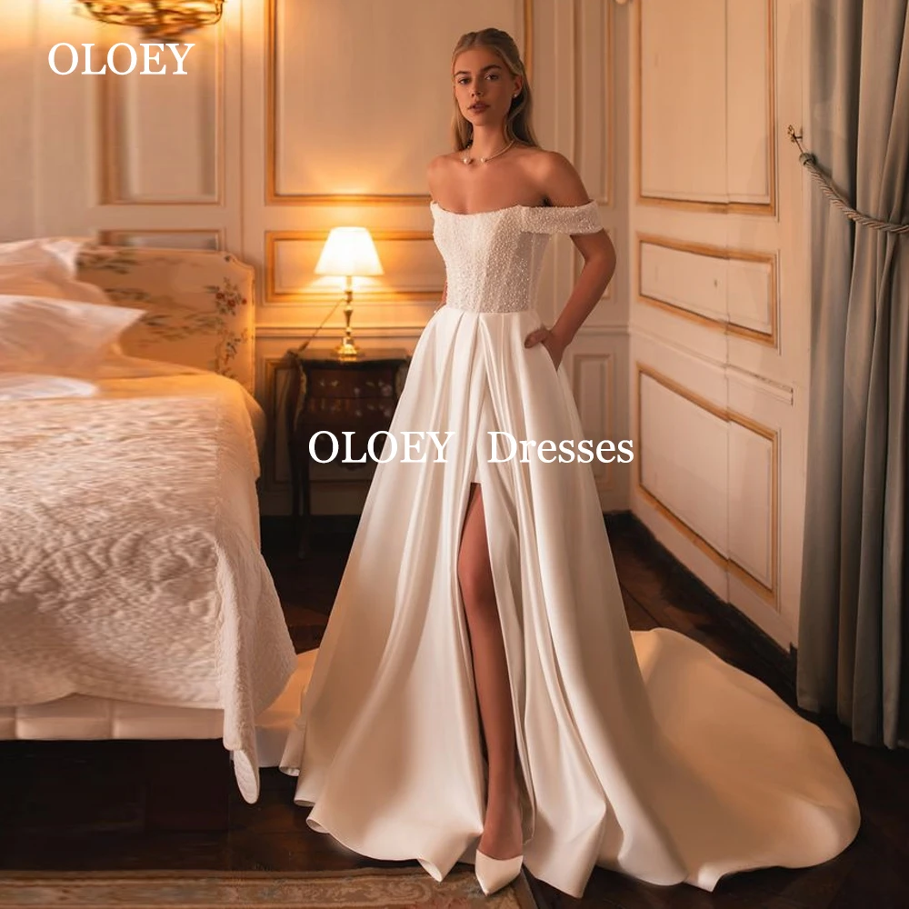 OLOEY Exquisite Beads Off Shoulder A Line Wedding Dresses Floor Length Satin Bridal Gown Side Slit Sweep Train Customized
OLOEY Exquisite Beads Off Shoulder A Line Wedding Dresses Floor Length Satin Bridal Gown Side Slit Sweep Train Customized