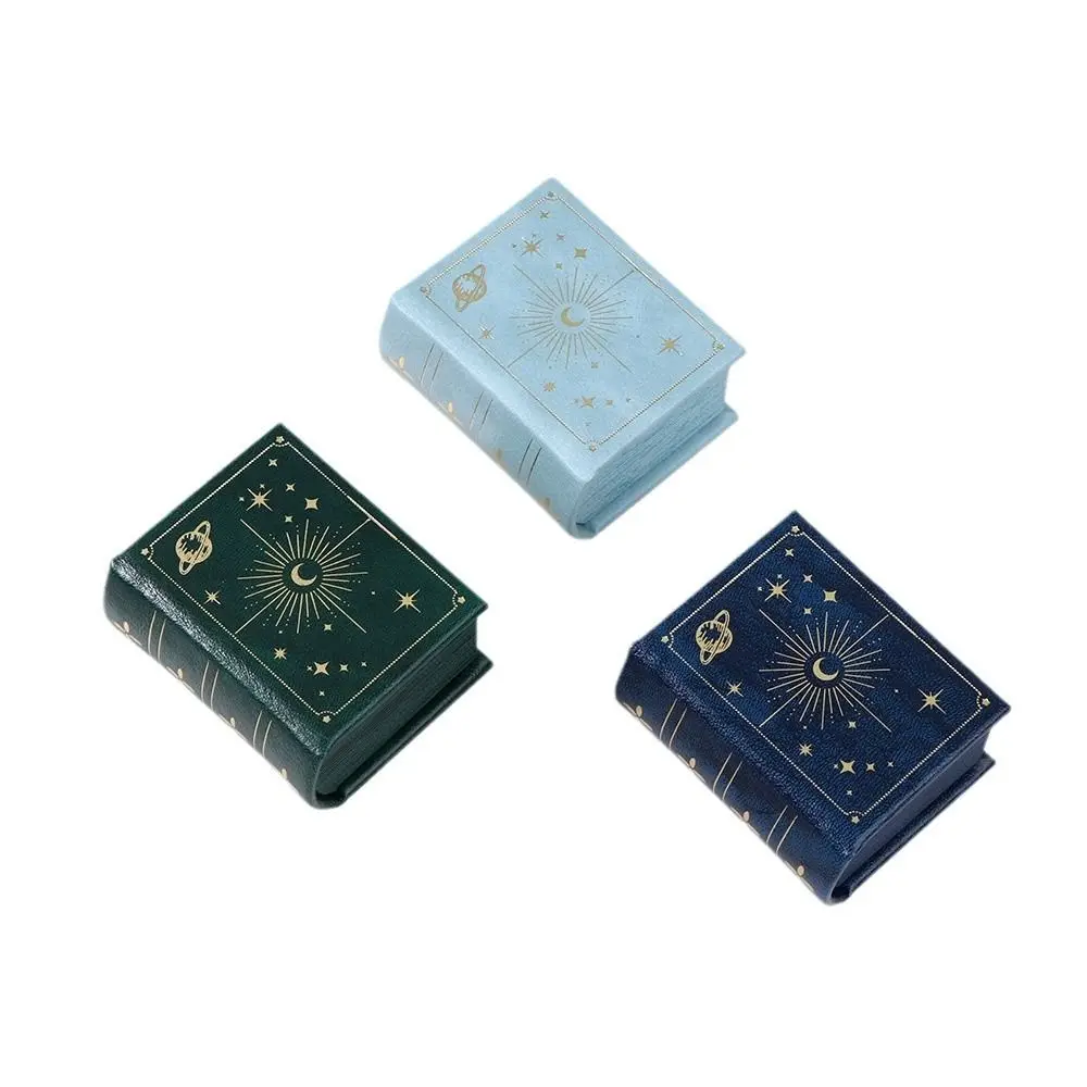 Новая коробка для колец из искусственной кожи с откидной крышкой, держатель для колец в форме книги, чехол для хранения подарков в стиле ретро ювелирных изделий
Новая коробка для колец из искусственной кожи с откидной крышкой, держатель для колец в форме книги, чехол для хранения подарков в стиле ретро ювелирных изделий