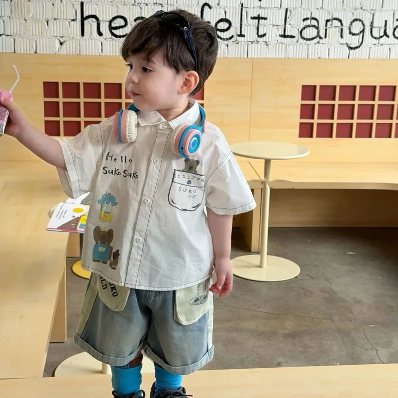 Children's Set 2026 Summer Boys Children's Little Bear Short Sleeve Printed White Shirt+Casual Patchwork Design Denim Shorts Set
Children's Set 2026 Summer Boys Children's Little Bear Short Sleeve Printed White Shirt+Casual Patchwork Design Denim Shorts Set
