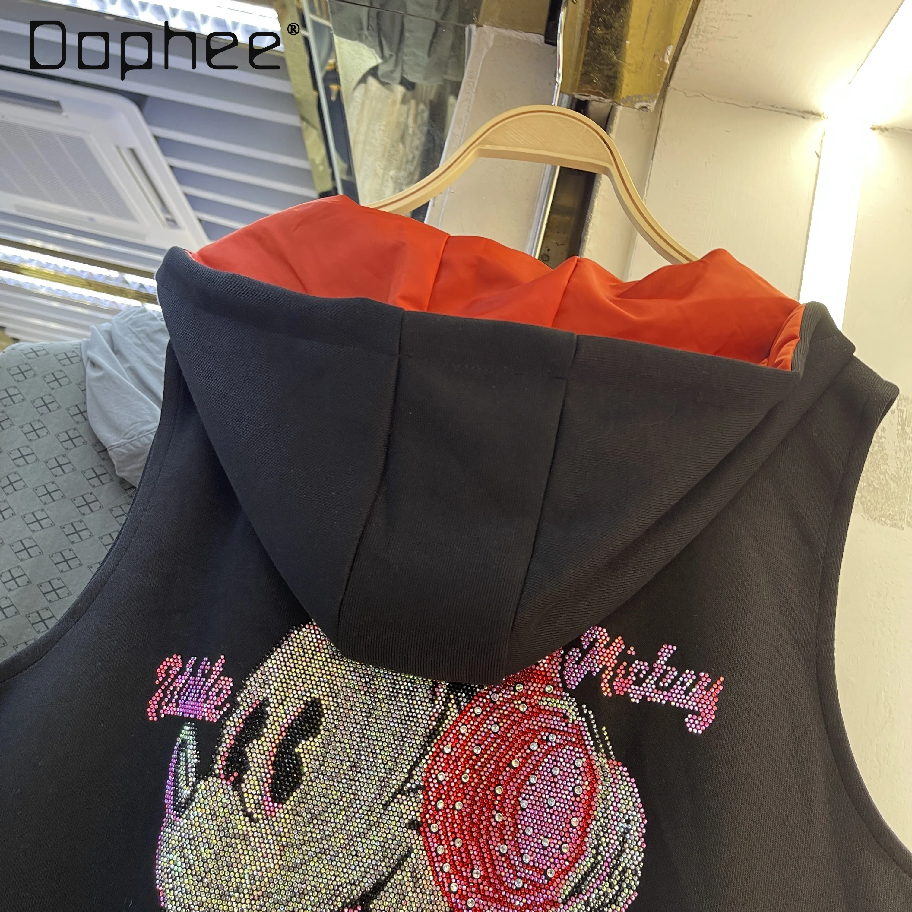 Hooded Vest for Women Spring and Autumn New Korean Fashion Versatile Loose Cartoon Rhinestone Vest Zip Up Sleeveless Jacket
Hooded Vest for Women Spring and Autumn New Korean Fashion Versatile Loose Cartoon Rhinestone Vest Zip Up Sleeveless Jacket