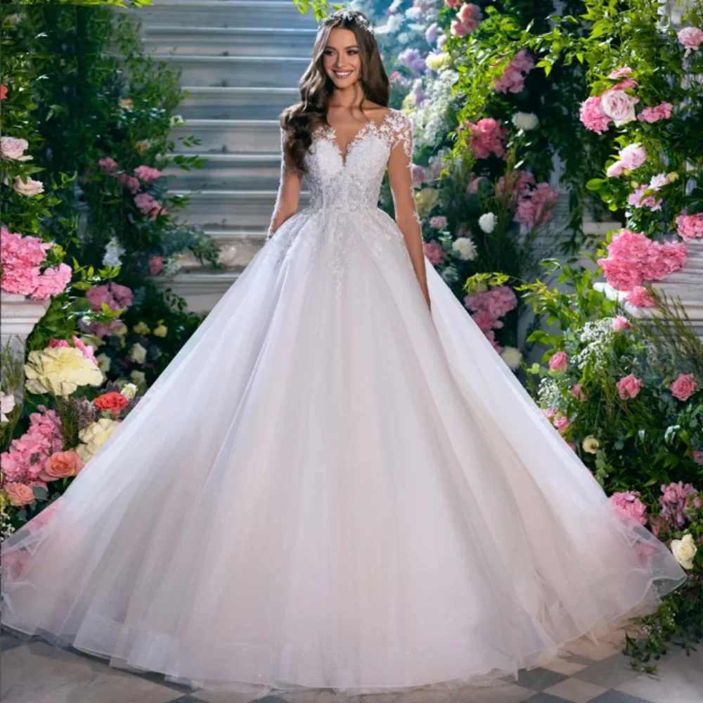 Vestidos de novia 2025 Прозрачное свадебное платье с круглым вырезом и длинными рукавами, кружевными аппликациями, свадебное платье трапециевидной формы из тюля, новое свадебное платье
Vestidos de novia 2025 Прозрачное свадебное платье с круглым вырезом и длинными рукавами, кружевными аппликациями, свадебное платье трапециевидной формы из тюля, новое свадебное платье