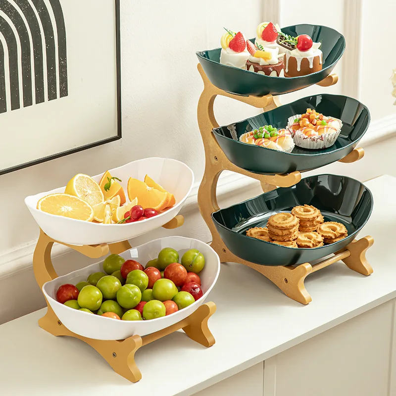 Wooden-framed plastic fruit tray, living room snack, nut and candy holder, home-use tea snack and fruit tray with a high-end
Wooden-framed plastic fruit tray, living room snack, nut and candy holder, home-use tea snack and fruit tray with a high-end