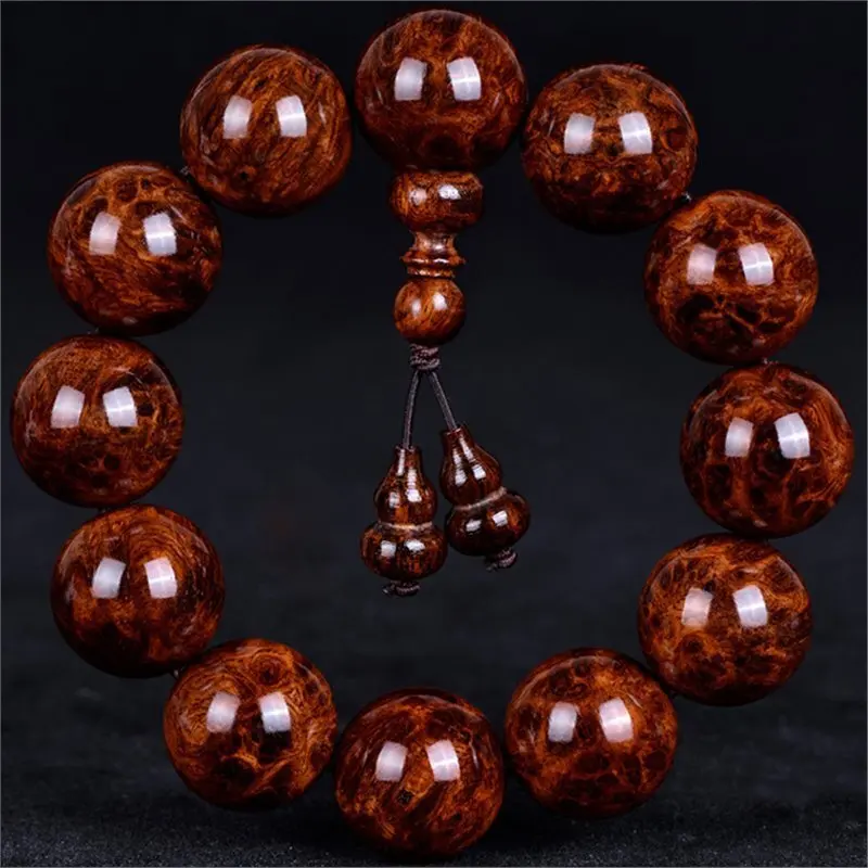 Hainan Huanghua Pear Eyes And Ghost Faces Facing Old Material Tumor Scars Men s Wooden Bracelet With Buddha Beads Wooden jewelr
Hainan Huanghua Pear Eyes And Ghost Faces Facing Old Material Tumor Scars Men s Wooden Bracelet With Buddha Beads Wooden jewelr