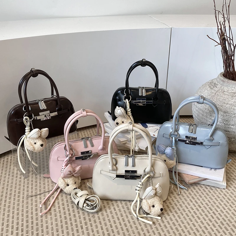 New Business Style Women's Handbag British Fashion Single Shoulder Bag Simple Shell Design with Belt Decoration Ladies Backpack
New Business Style Women's Handbag British Fashion Single Shoulder Bag Simple Shell Design with Belt Decoration Ladies Backpack