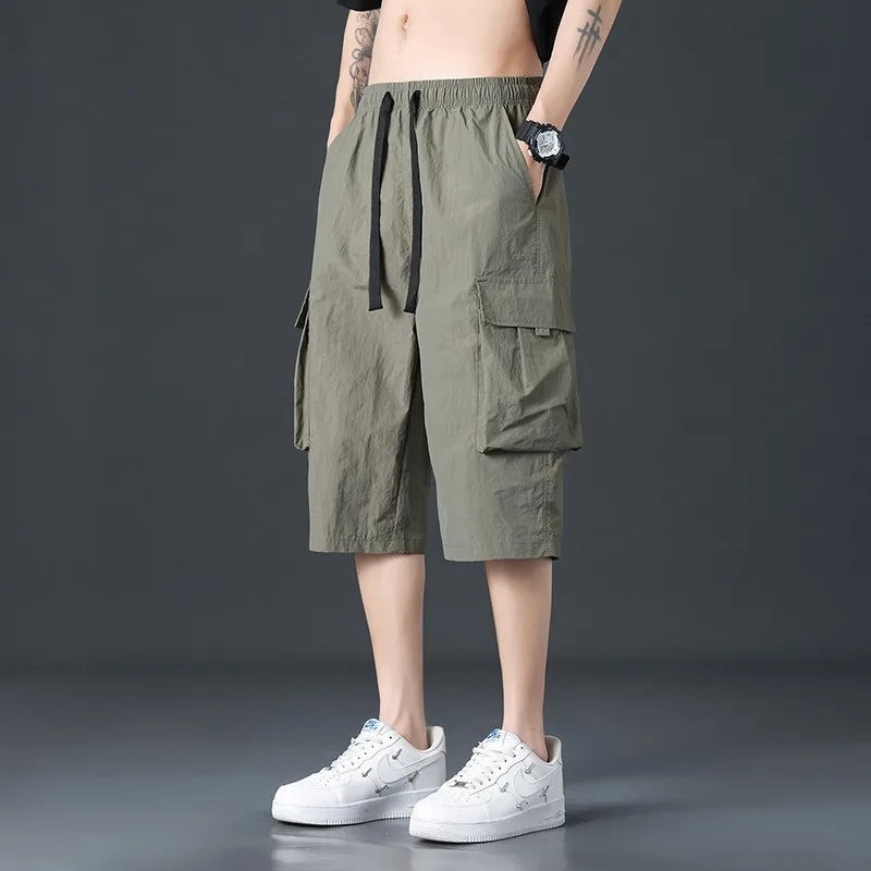 Men's Elastic Waist Drawstring Cargo Capri Pants Quick Dry Loose Multi Pocket Casual Knee Length Summer Shorts
Men's Elastic Waist Drawstring Cargo Capri Pants Quick Dry Loose Multi Pocket Casual Knee Length Summer Shorts