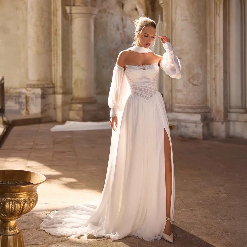 Свадебное платье из шифона на заказ с отстегивающимися рукавами-«епископами», высоким боковым разрезом и шлейфом для свадебной церемонии
Свадебное платье из шифона на заказ с отстегивающимися рукавами-«епископами», высоким боковым разрезом и шлейфом для свадебной церемонии