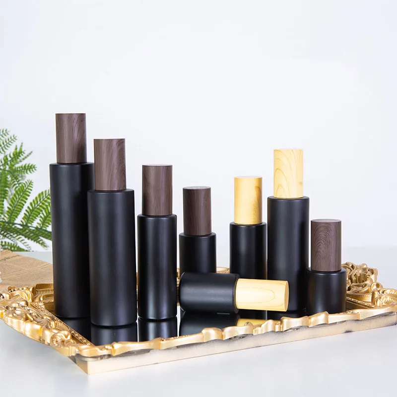Dark Wooden Grain Lids Skin Cosmetic Body Butter Oil Luxury Matte Black Cream Cosmetic Glass Jars with Plastic Wood Grain Lid
Dark Wooden Grain Lids Skin Cosmetic Body Butter Oil Luxury Matte Black Cream Cosmetic Glass Jars with Plastic Wood Grain Lid
