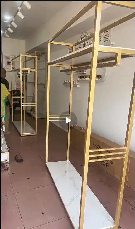 Gold Double-Layer Hanger Floor-Mounted Women's Clothing Display Rack High-Grade Store Shelves for Fashionable Apparel
Gold Double-Layer Hanger Floor-Mounted Women's Clothing Display Rack High-Grade Store Shelves for Fashionable Apparel