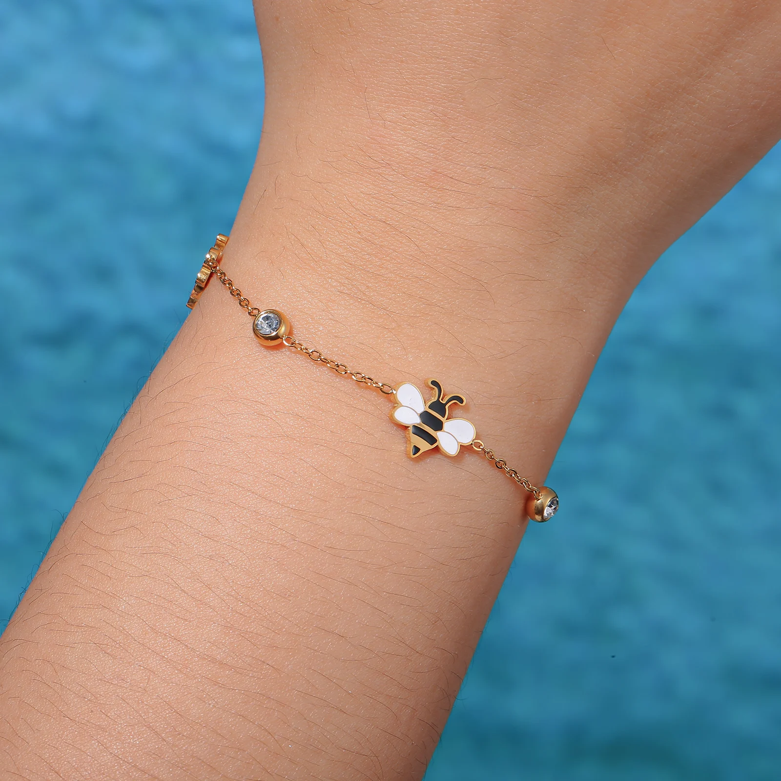 Golden Tone Stainless Steel Bee Charm Bracelet with Crystal Accents for Women
Golden Tone Stainless Steel Bee Charm Bracelet with Crystal Accents for Women