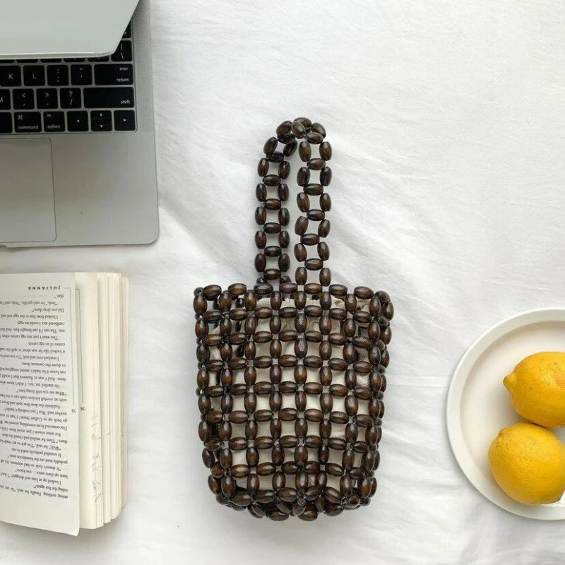 Retro Handmade Wooden Bead Woven Bucket Bag, Creative Handbag Women Mini Hollow Bucket Bag, Summer Wrist Bag With Inner Pocket
Retro Handmade Wooden Bead Woven Bucket Bag, Creative Handbag Women Mini Hollow Bucket Bag, Summer Wrist Bag With Inner Pocket