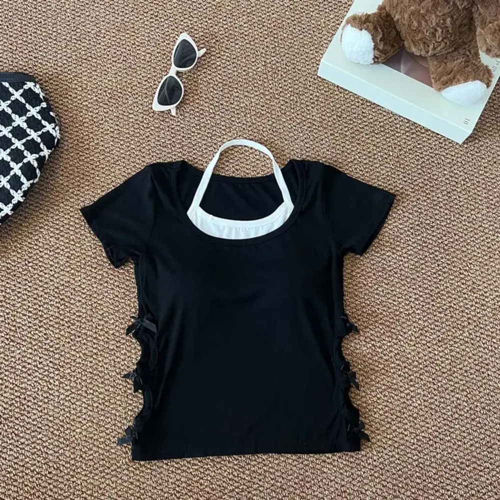 Женская укороченная футболка-халтер с бантом, имитация двухслойного дизайна, облегающая, с вырезами, в стиле Y2K
Женская укороченная футболка-халтер с бантом, имитация двухслойного дизайна, облегающая, с вырезами, в стиле Y2K