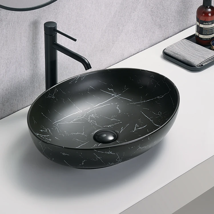High quality black oval wash basin modern art ceramic countertop bathroom basin marble sink bathroom basin bowl
High quality black oval wash basin modern art ceramic countertop bathroom basin marble sink bathroom basin bowl