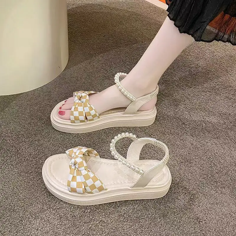 Fairy Summer Sandals 2026 New Checkerboard Bow Pearl Flat Beach Shoes for Women to Wear with Dresses
Fairy Summer Sandals 2026 New Checkerboard Bow Pearl Flat Beach Shoes for Women to Wear with Dresses