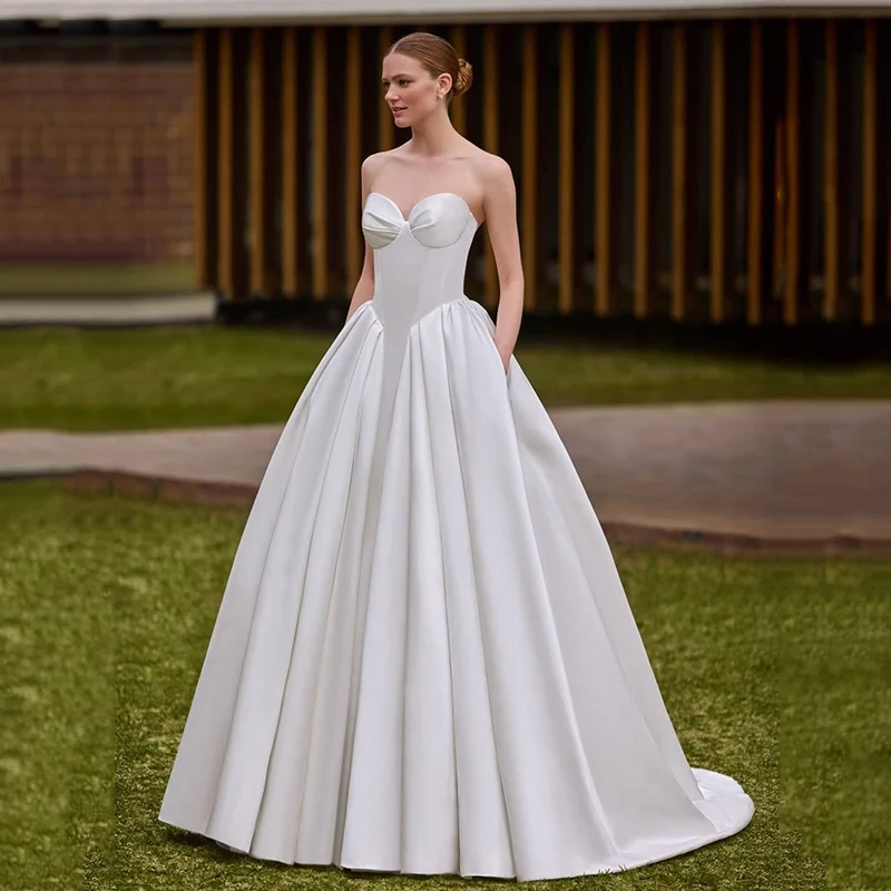 Элегантное свадебное платье Eightree А-силуэта с вырезом «сердечко», карманами и пуговицами, вечернее бальное платье 2026 года, свадебное выпускное платье на заказ
Элегантное свадебное платье Eightree А-силуэта с вырезом «сердечко», карманами и пуговицами, вечернее бальное платье 2026 года, свадебное выпускное платье на заказ