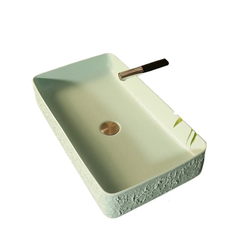 Modern simple European art basin on the table Rectangular ceramic washbasin on the washbasin
Modern simple European art basin on the table Rectangular ceramic washbasin on the washbasin