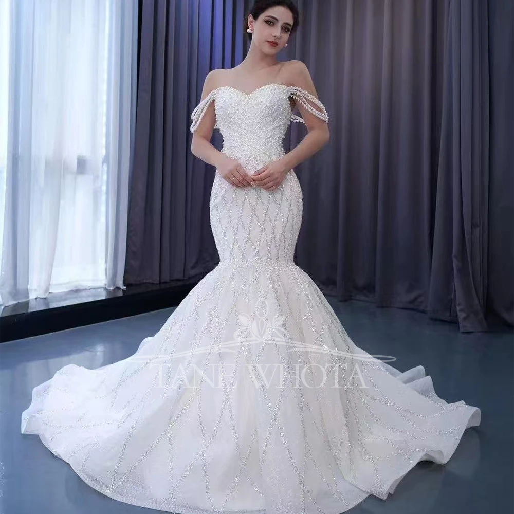 Vestido Novia 2025 с открытыми плечами, милое свадебное платье со шнуровкой сзади, расшитое бисером и блестками, индивидуальное сексуальное свадебное платье
Vestido Novia 2025 с открытыми плечами, милое свадебное платье со шнуровкой сзади, расшитое бисером и блестками, индивидуальное сексуальное свадебное платье