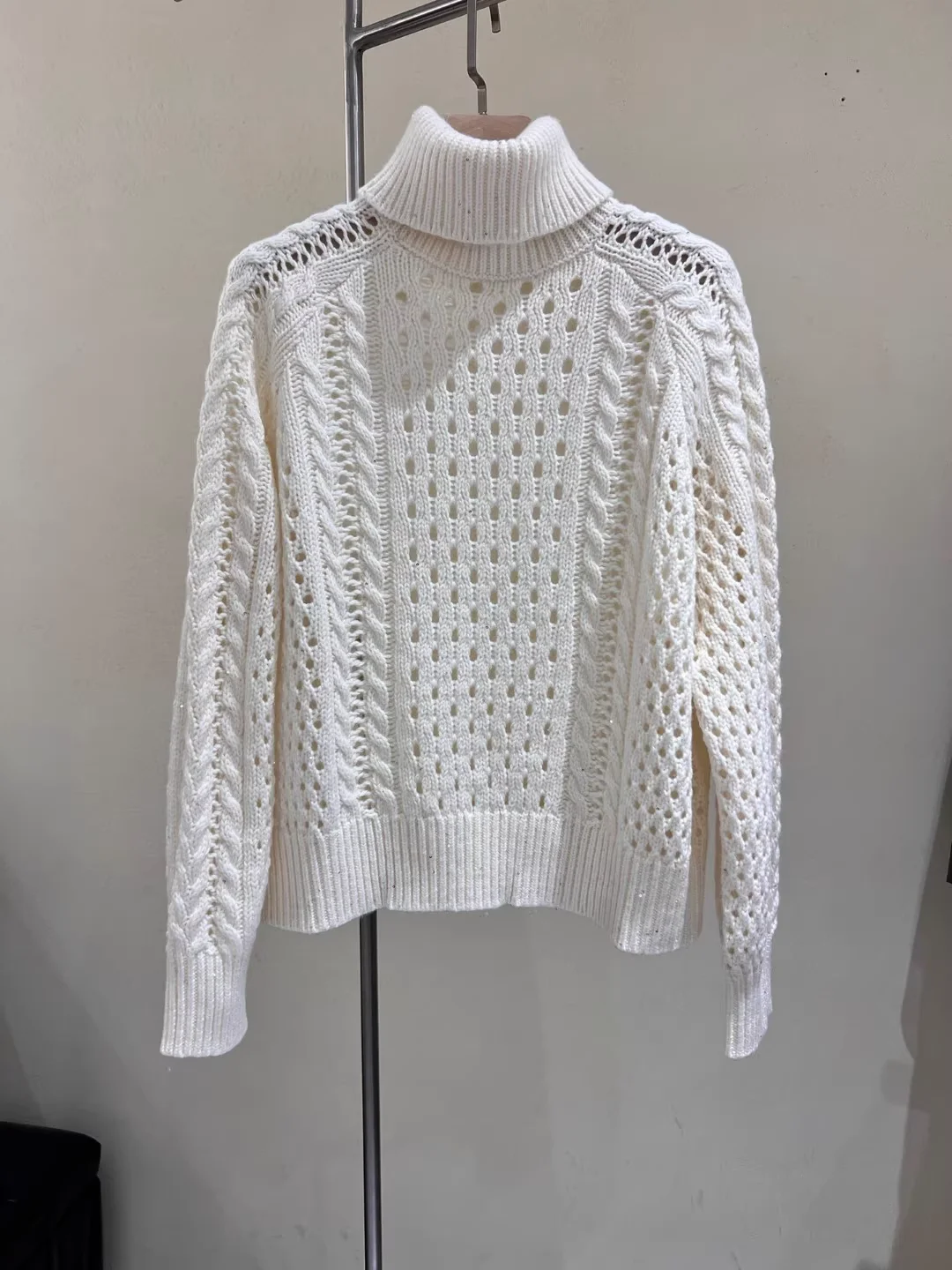 Women's Sequin Hollow Out Knitted Pullover High Neck Long Sleeve Solid Color Loose Casual Sweater
Women's Sequin Hollow Out Knitted Pullover High Neck Long Sleeve Solid Color Loose Casual Sweater