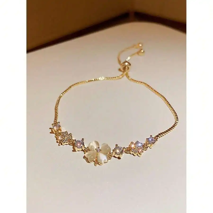 Adjustable Pull Chain Bracelet With Rhinestone And Cats Eye Flower Design
Adjustable Pull Chain Bracelet With Rhinestone And Cats Eye Flower Design