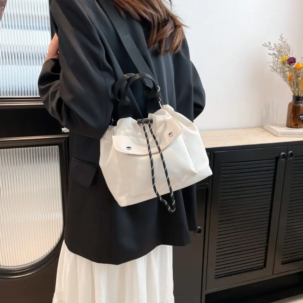 Korean Style Drawstring Bucket Bag Purse Handbag Nylon Shoulder Bag Solid Color Mobile Phone Bag Small Crossbody Bag
Korean Style Drawstring Bucket Bag Purse Handbag Nylon Shoulder Bag Solid Color Mobile Phone Bag Small Crossbody Bag