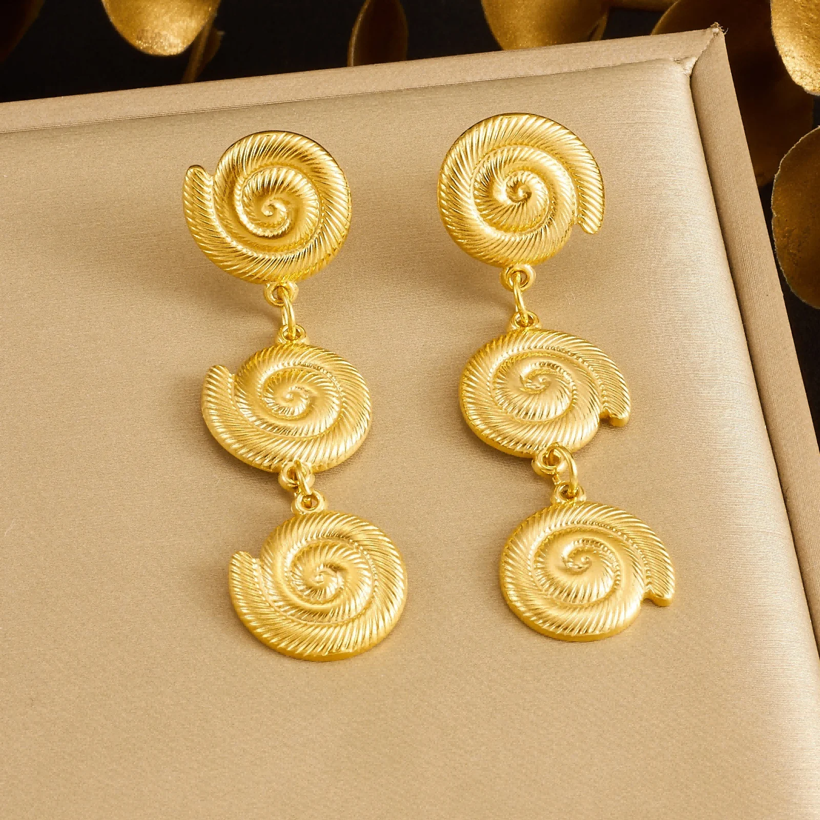 Gold Tone 316L Stainless Steel Spiral Seashell Drop Earrings, Vintage Textured Statement Design
Gold Tone 316L Stainless Steel Spiral Seashell Drop Earrings, Vintage Textured Statement Design