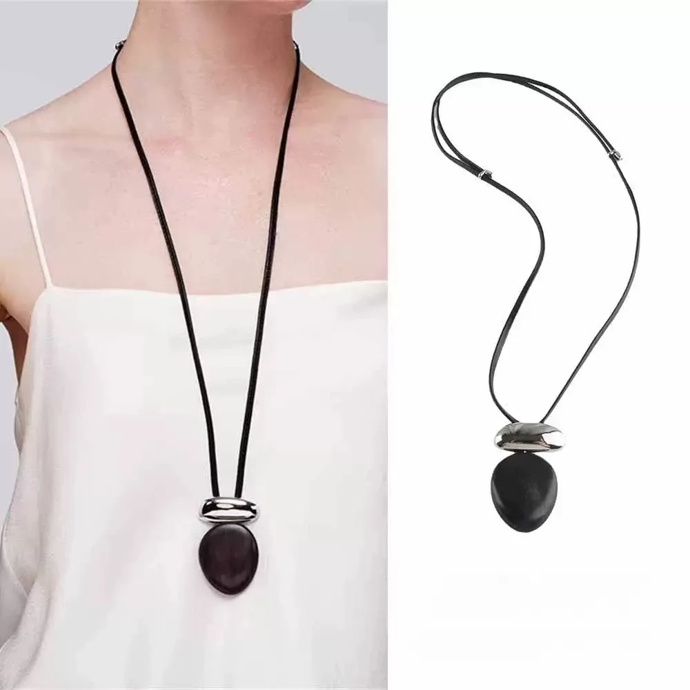 Elegant Oval-Shaped Ebony & Metal Fusion Necklace - Premium Leather Cord, Unique Long Sweater Chain For Men Or Women M471
Elegant Oval-Shaped Ebony & Metal Fusion Necklace - Premium Leather Cord, Unique Long Sweater Chain For Men Or Women M471