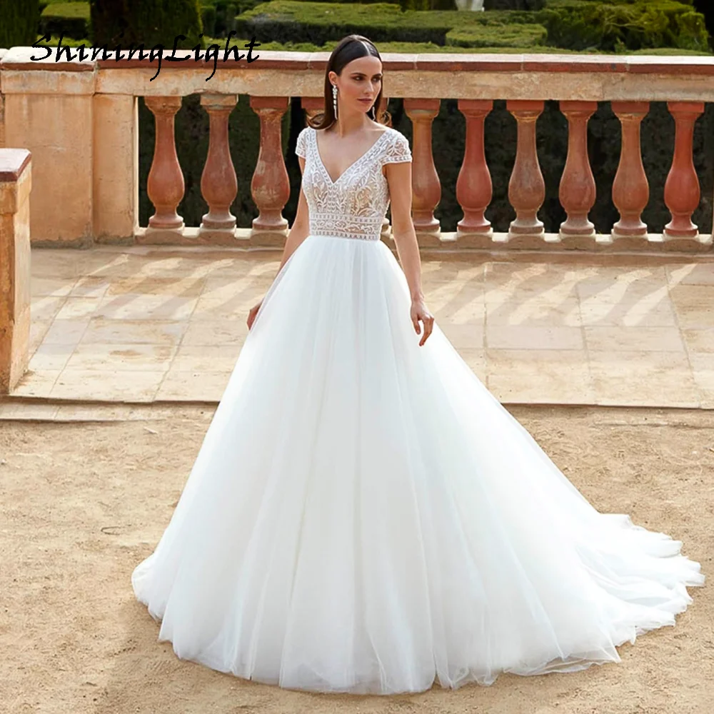 ShiningLight Beach A Line Wedding Dress For Bride V-Neck Backless Tulle Bride Gowns Backless vestidos de novia Customized
ShiningLight Beach A Line Wedding Dress For Bride V-Neck Backless Tulle Bride Gowns Backless vestidos de novia Customized