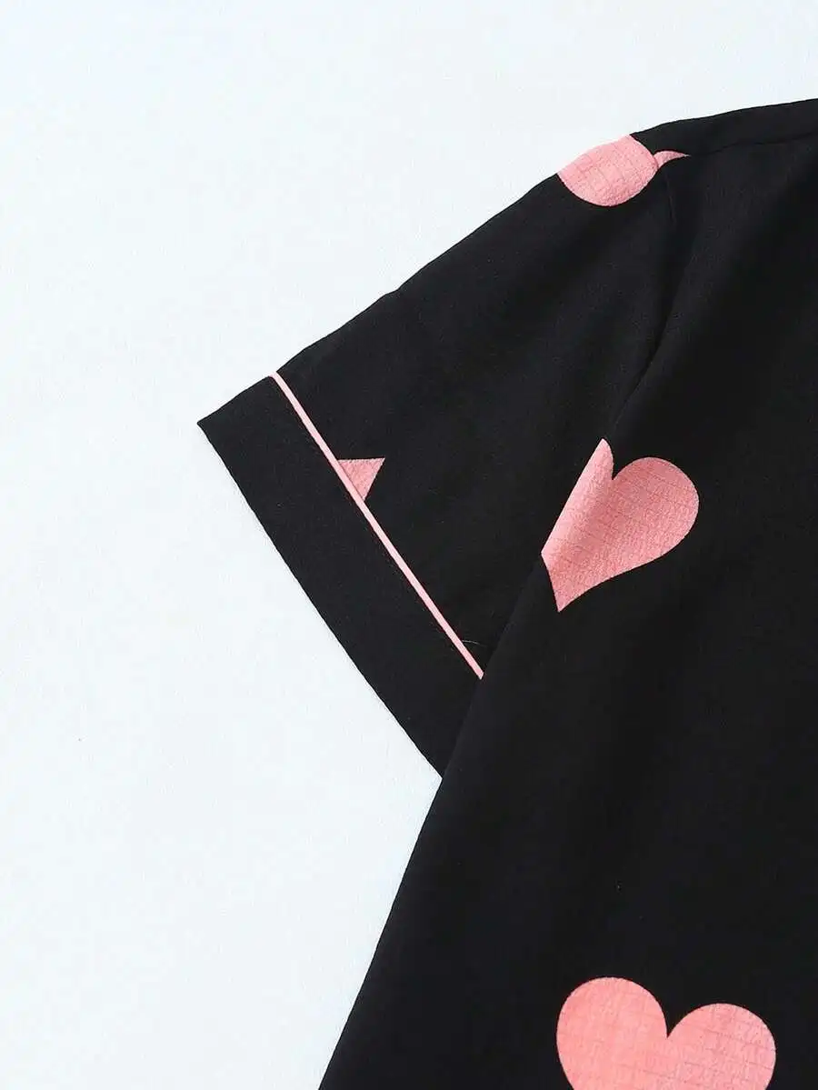 Womens Black Pajama Set With Pink Heart Print, Button-Down Top And Elastic Waist Shorts
Womens Black Pajama Set With Pink Heart Print, Button-Down Top And Elastic Waist Shorts