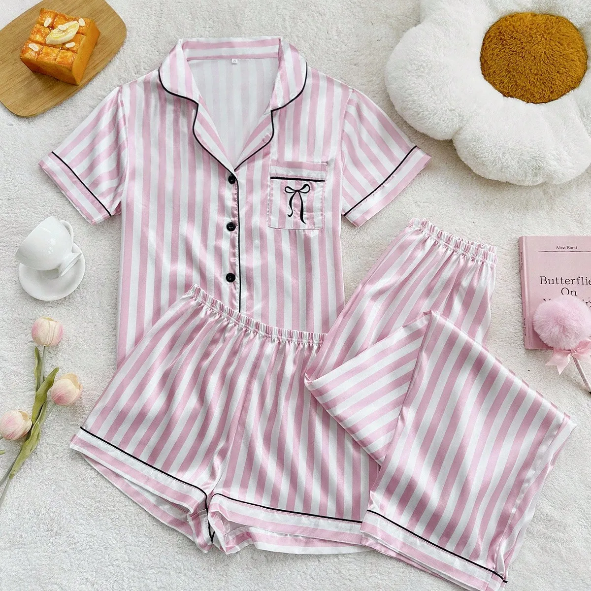 Women’s Pink Stripe Bow Print Faux Silk Pajama Set, Button-Down Short Sleeve Top with Pants Pajamas Soft Loungewear Sleepwear
Women’s Pink Stripe Bow Print Faux Silk Pajama Set, Button-Down Short Sleeve Top with Pants Pajamas Soft Loungewear Sleepwear