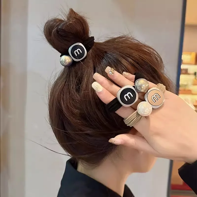 Korean version of high grade sense pearl letters hair clip and cute girl's heart accessory, with curly on the back of the head
Korean version of high grade sense pearl letters hair clip and cute girl's heart accessory, with curly on the back of the head
