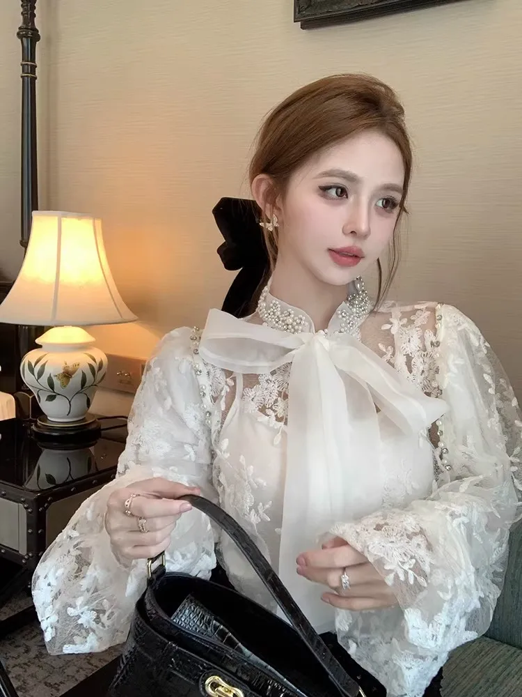 Women Lace Top 2026New Rhinestone Bead Big Bow Tie Tied Bubble Sleeve Blouse Elegant Mesh Embroidered Hollow Two-Piece Shirt Set
Women Lace Top 2026New Rhinestone Bead Big Bow Tie Tied Bubble Sleeve Blouse Elegant Mesh Embroidered Hollow Two-Piece Shirt Set