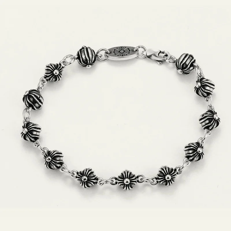 Gothic Silver-Tone Bracelet with Ornate Floral & Ribbed Bead Links
Gothic Silver-Tone Bracelet with Ornate Floral & Ribbed Bead Links