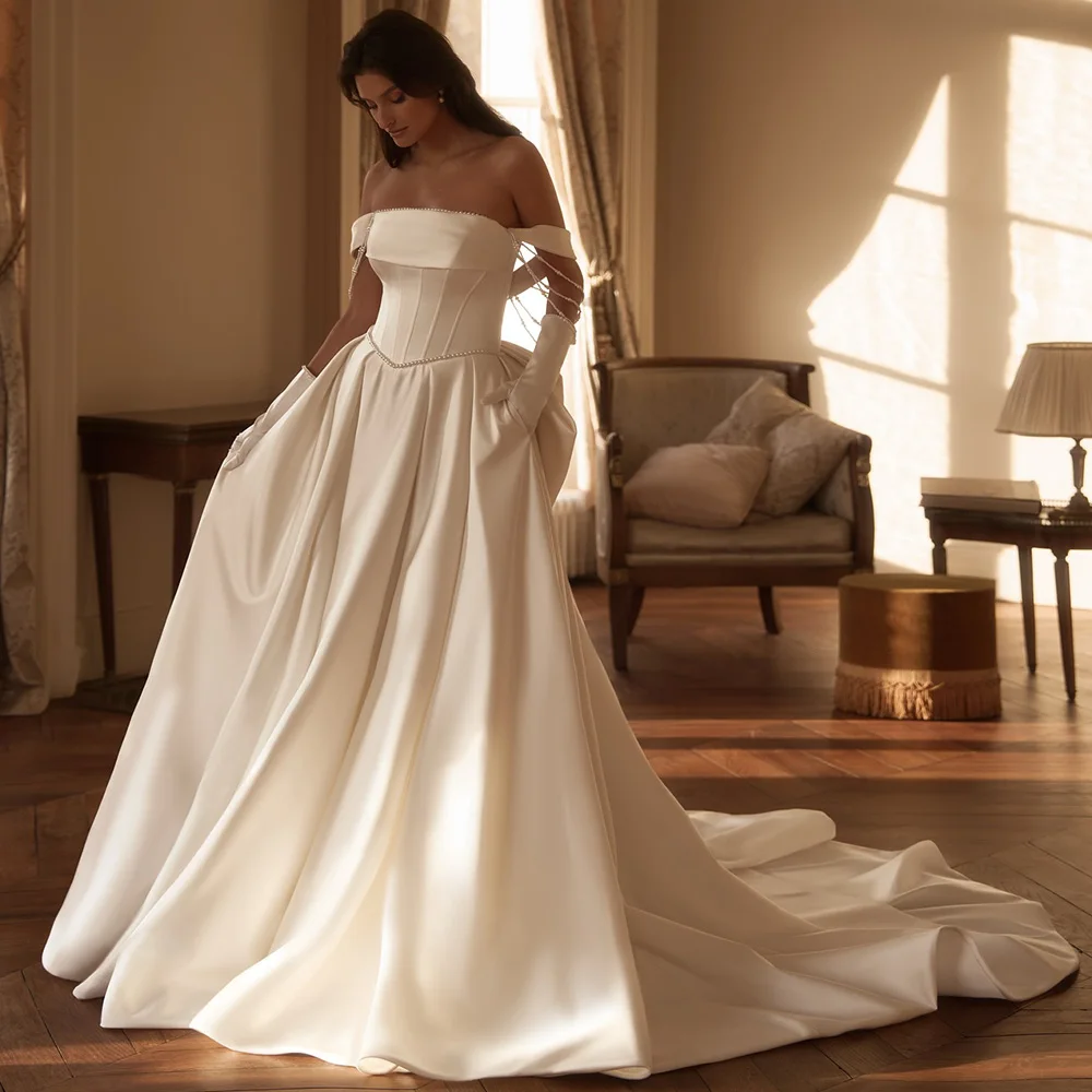 Elegant Satin Customized Wedding Dress with Off the Shoulder Exquisite Beading Bow Bridal Gowns Dreamy Strapless Robe de mariée
Elegant Satin Customized Wedding Dress with Off the Shoulder Exquisite Beading Bow Bridal Gowns Dreamy Strapless Robe de mariée
