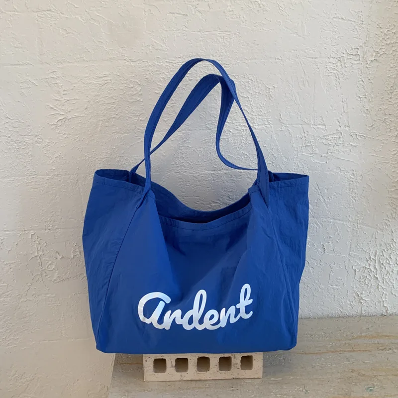 Fashionable and Simple Large Capacity Casual Nylon Tote Bag with Letter Pattern Solid Color Simple Daily Commuting Shoulder Bag
Fashionable and Simple Large Capacity Casual Nylon Tote Bag with Letter Pattern Solid Color Simple Daily Commuting Shoulder Bag