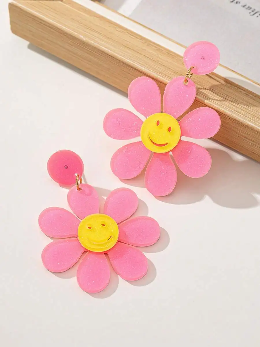 Glittery Pink Daisy Drop Earrings With Yellow Smiley Face Center For Adults
Glittery Pink Daisy Drop Earrings With Yellow Smiley Face Center For Adults