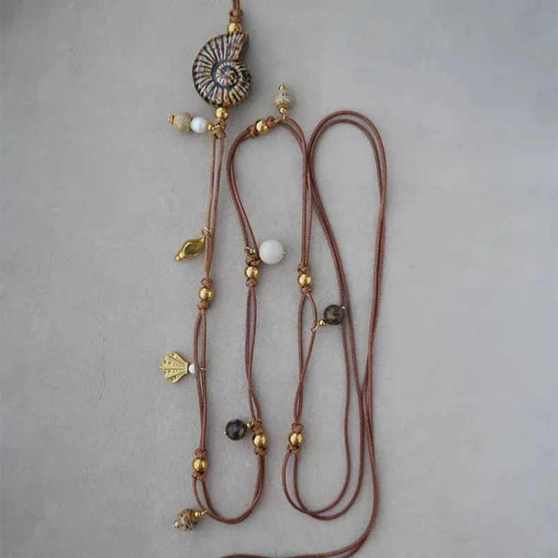 Retro Ethnic Style Conch Ceramic Bead Necklace Light Luxury Niche Design Multi-wear Method Nautilus Waist Chain Necklace
Retro Ethnic Style Conch Ceramic Bead Necklace Light Luxury Niche Design Multi-wear Method Nautilus Waist Chain Necklace