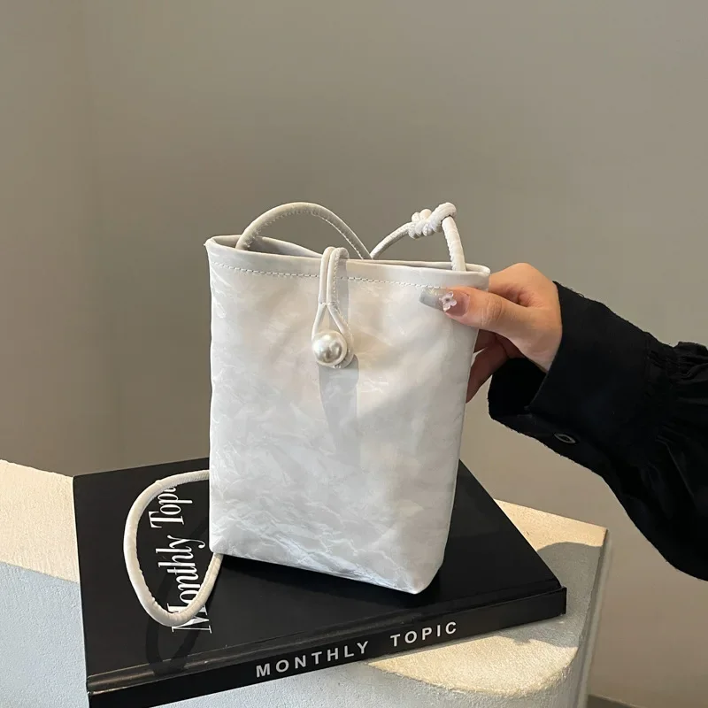 Simple bag Women's trendy high-end sense versatile mobile phone bag Vertical casual square handbag
Simple bag Women's trendy high-end sense versatile mobile phone bag Vertical casual square handbag