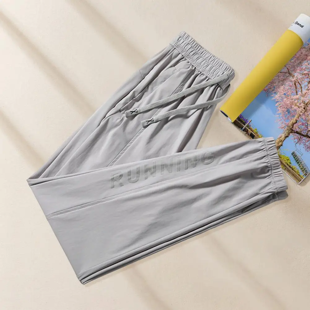 Solid Color Men Bottoms Quick Dry Unisex Gym Sweatpants with Side Pockets Drawstring Waist Ice Silk Ankle-banded for Jogging
Solid Color Men Bottoms Quick Dry Unisex Gym Sweatpants with Side Pockets Drawstring Waist Ice Silk Ankle-banded for Jogging
