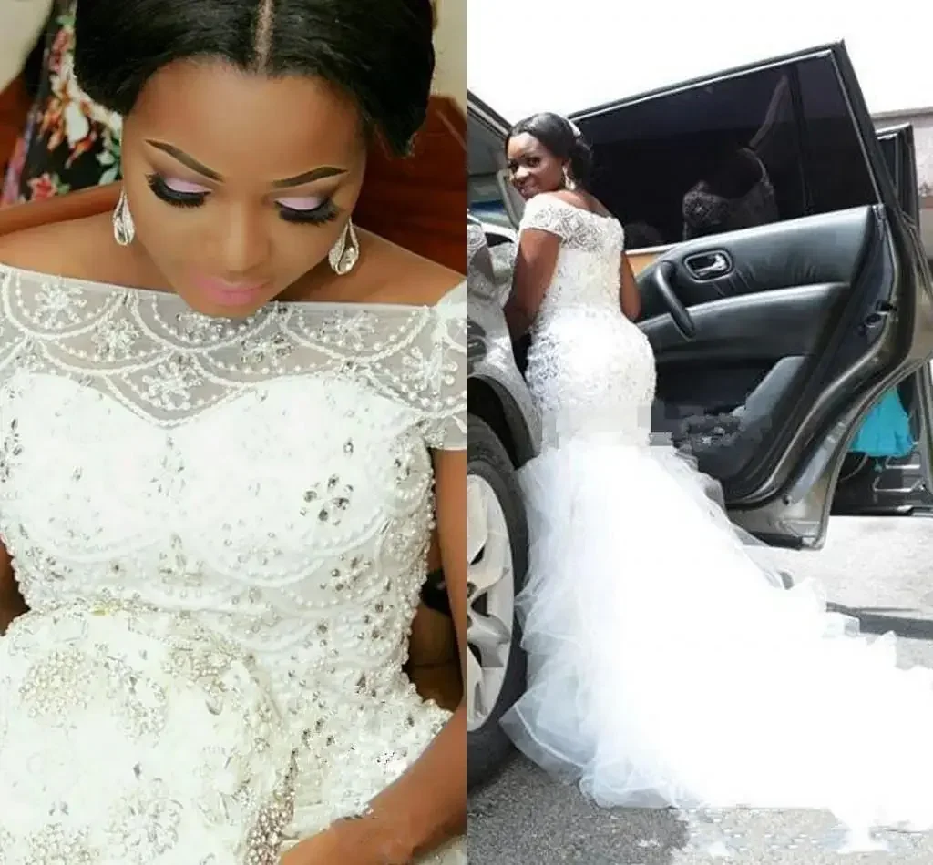 Customized African Nigeria Mermaid Wedding Dresses Off Shoulder Crystal Beaded Tiered Ruffles Court Train Custom Plus Size Forma
Customized African Nigeria Mermaid Wedding Dresses Off Shoulder Crystal Beaded Tiered Ruffles Court Train Custom Plus Size Forma