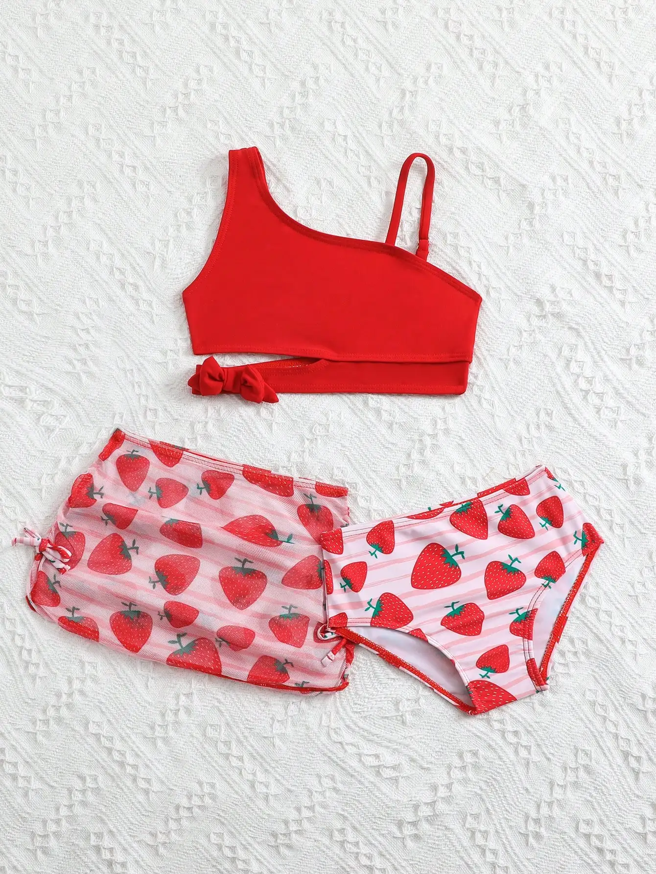 Купальник из двух частей для девочек с асимметричным топом с клубничным принтом и прозрачной юбкой для пляжа
Купальник из двух частей для девочек с асимметричным топом с клубничным принтом и прозрачной юбкой для пляжа