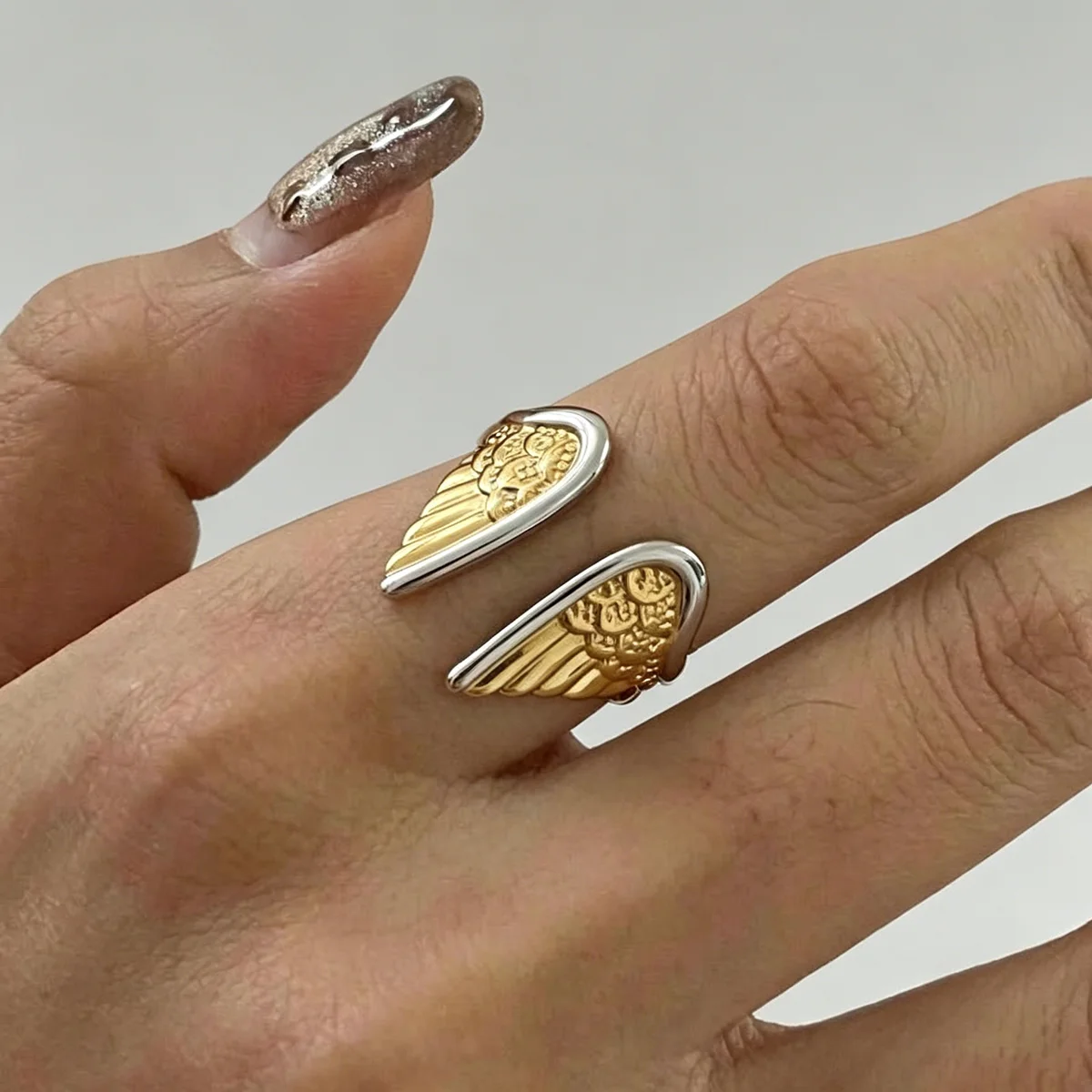 Two Tone Angel Wing Adjustable Open Ring Stainless Steel Niche Minimalist Statement Jewelry For Women Daily Wear
Two Tone Angel Wing Adjustable Open Ring Stainless Steel Niche Minimalist Statement Jewelry For Women Daily Wear