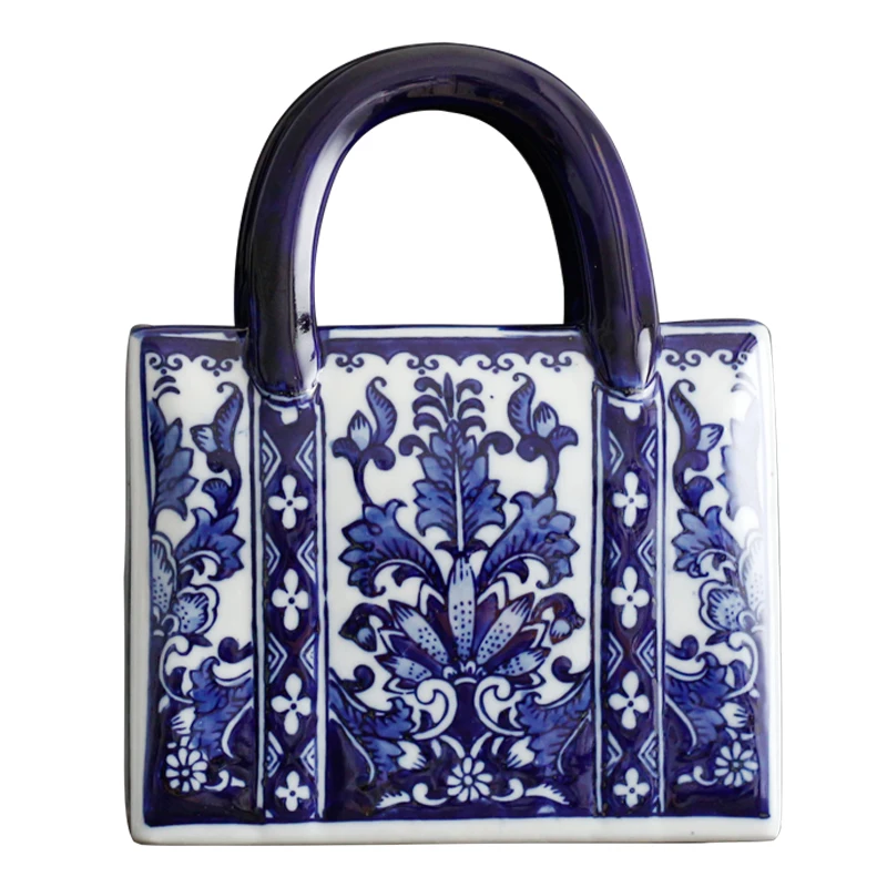 Customized ceramic creative handmade flower pot Chinese handbag shape vase porcelain Chinese style blue and white handbag vase
Customized ceramic creative handmade flower pot Chinese handbag shape vase porcelain Chinese style blue and white handbag vase