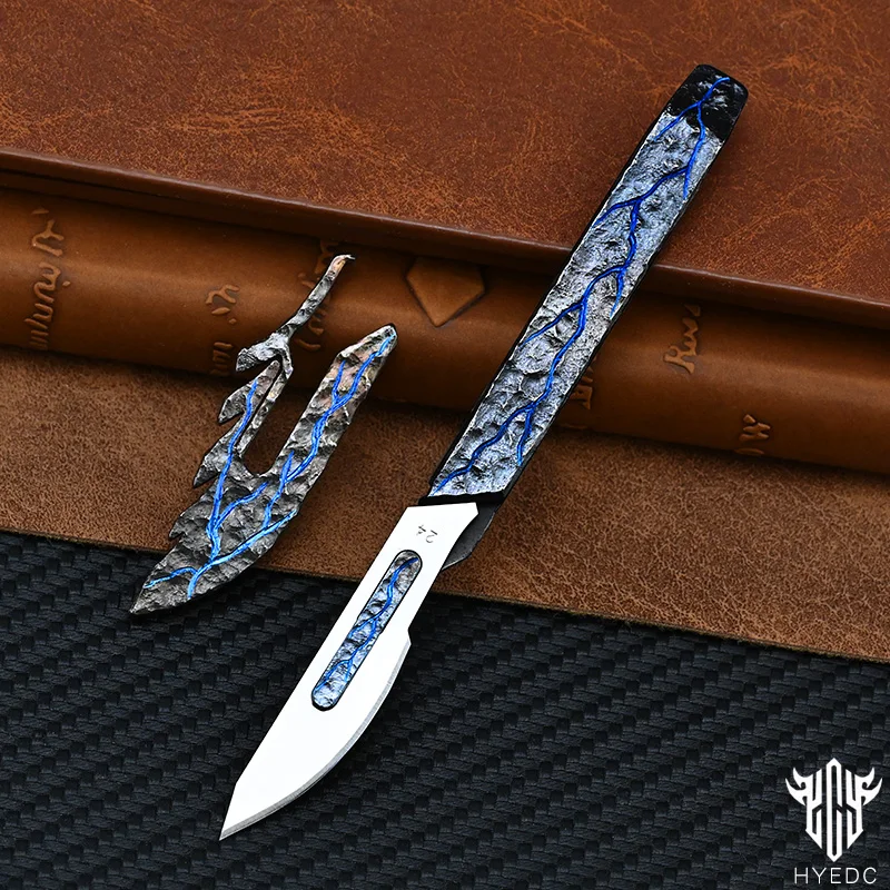 Hand Carving Rock Texture Titanium Alloy Camping Knife Sharp Folding Keychain Gift Carry-on Safe Sharp Folding Knife EDC
Hand Carving Rock Texture Titanium Alloy Camping Knife Sharp Folding Keychain Gift Carry-on Safe Sharp Folding Knife EDC