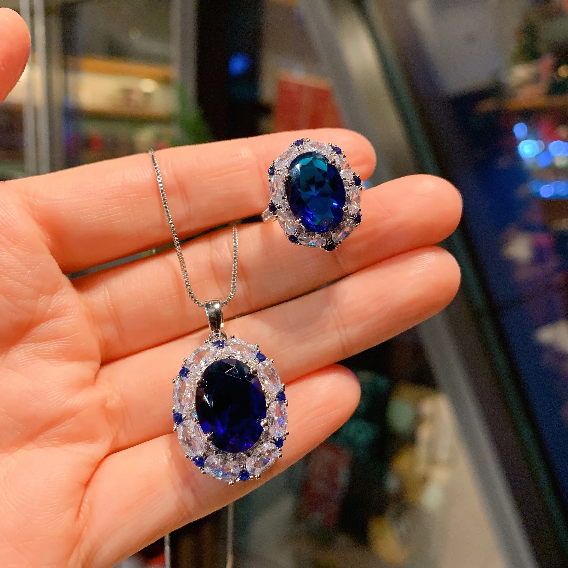 10x14mm Oval Shape Blue Sapphire Red Ruby Cubic Zircon Pendant Necklace Adjustable Ring Jewelry Set
10x14mm Oval Shape Blue Sapphire Red Ruby Cubic Zircon Pendant Necklace Adjustable Ring Jewelry Set