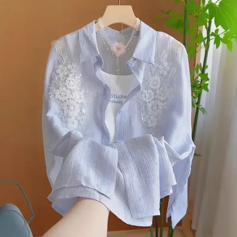 Light Blue Embroidered Floral Shirt For Women Casual Sweet Style With Delicate Lace Detailing And Single Button Front Design
Light Blue Embroidered Floral Shirt For Women Casual Sweet Style With Delicate Lace Detailing And Single Button Front Design