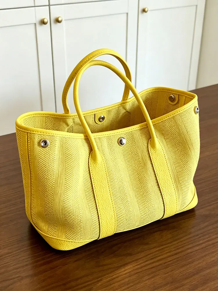 Yellow Large Capacity Canvas Tote Bag Women's Commuter Bag 2026 New Style High-End Sensation Garden Bag Summer Handbag
Yellow Large Capacity Canvas Tote Bag Women's Commuter Bag 2026 New Style High-End Sensation Garden Bag Summer Handbag